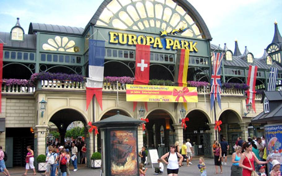 Flags from various countries in Europe decorate the main entrance to the Europa Park amusement park.