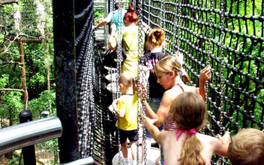 Children negotiate a swaying bridge at the Biosphärenhaus.