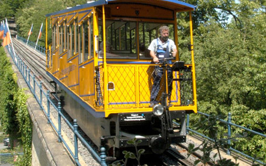 A car of the Nerobergbahn reaches the lower station to unload passengers and its water ballast. The cable car makes the journey every 15 minutes.
