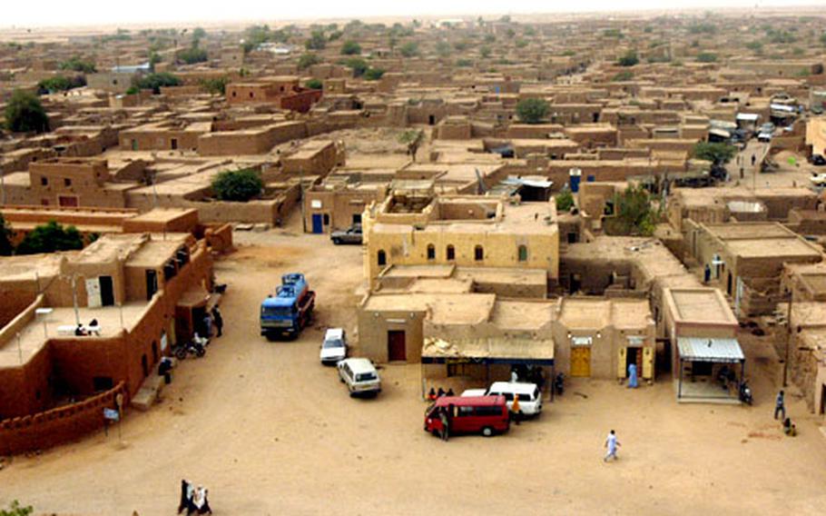 Agadez, Niger, a city of about 40,000 people, has for centuries been a crossroads for traders and camel caravans on the southern edge of the Sahara desert, seen in the background.