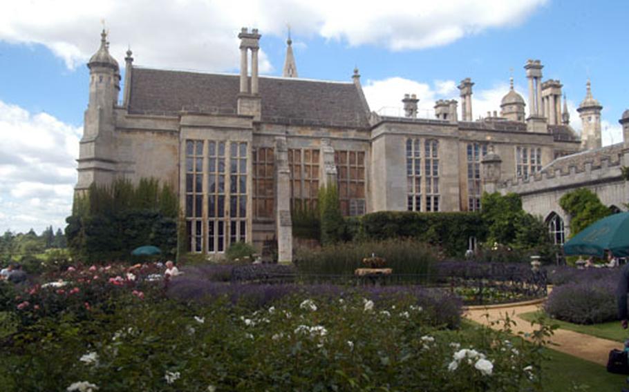 A garden on the grounds at Burghley House in Stamford, England, is used for dining and offers a good view of the house.