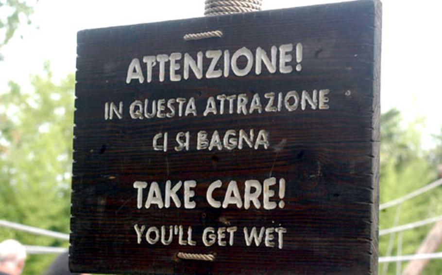 There are various warning signs in Italian and English throughout the park. Many of them speak of dangers on rides for those with particular health problems. Others, like this one, serve to let riders know they’ll be getting wet.