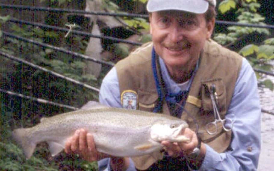 Writer Norm Zeigler with a big rainbow trout he caught in the Weisse Traun on a recent trip to Germany.