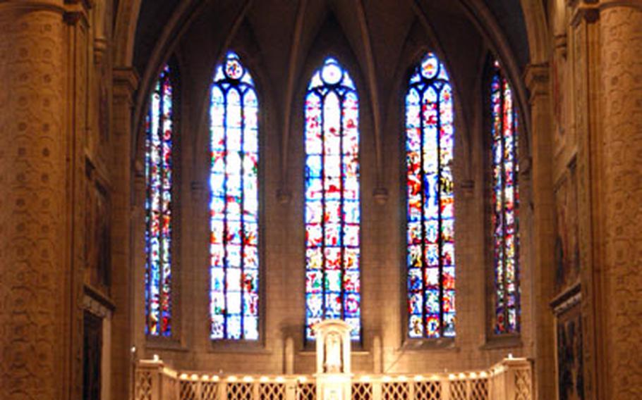 Inside the Cathedral of Our Lady of Luxembourg. The rear part of the cathedral dates back to the beginning of the 17th century; the front part, including the choir with its stained-glass window, was built between 1935 and -38.