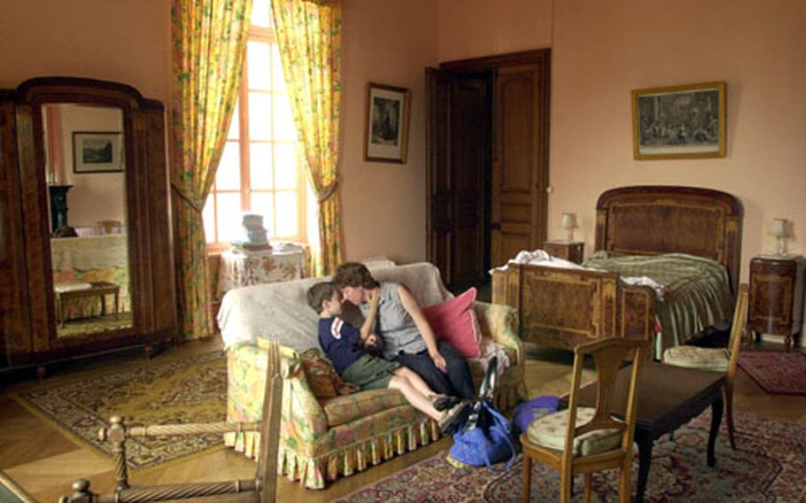 For the cost of a Red Roof Inn, you can get a cavernous room at a real chateau in Villersexel near Mulhouse. Dr. Chris Bryant, an American pediatrician and epidemiologist, shares a moment with her son, Jefferson.