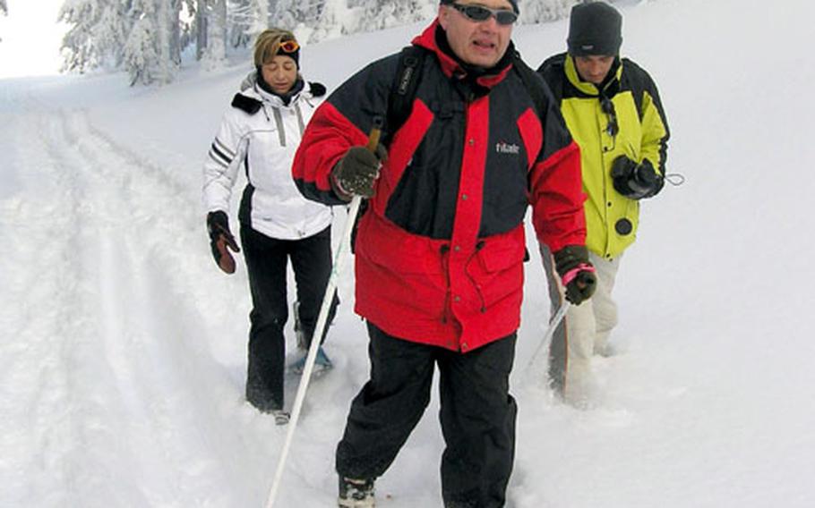 Jan Brezina, front, a Czech member of the European Parliament, enjoys snowshoeing on trails a the Cervenohorské sedlo resort.