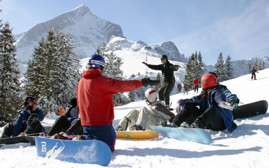 Students learn the basics of snowboarding from Mike Ensor, an Edelweiss Resort instructor, at the Hausberg Ski Area in Garmisch.