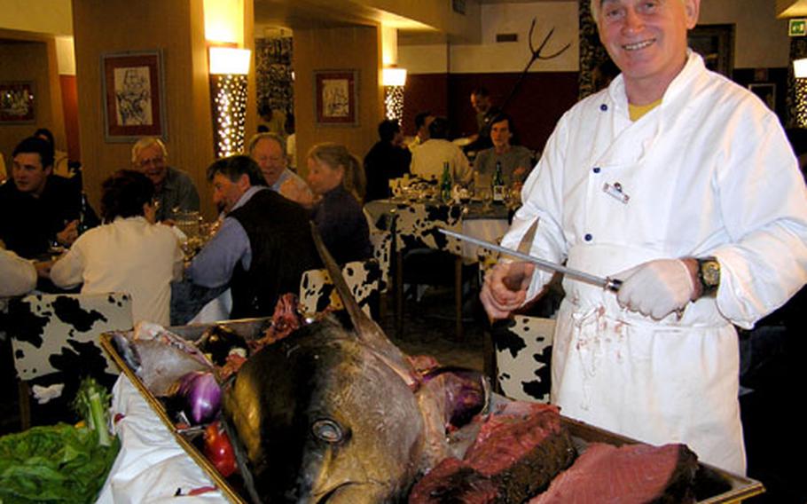 A Club Med Cervinia chef carves a tuna for hungry guests. Don’t go there expecting to diet. All the food you can eat, wine at lunch and dinner and drinks in between, are included in the price of a Club Med package vacation.