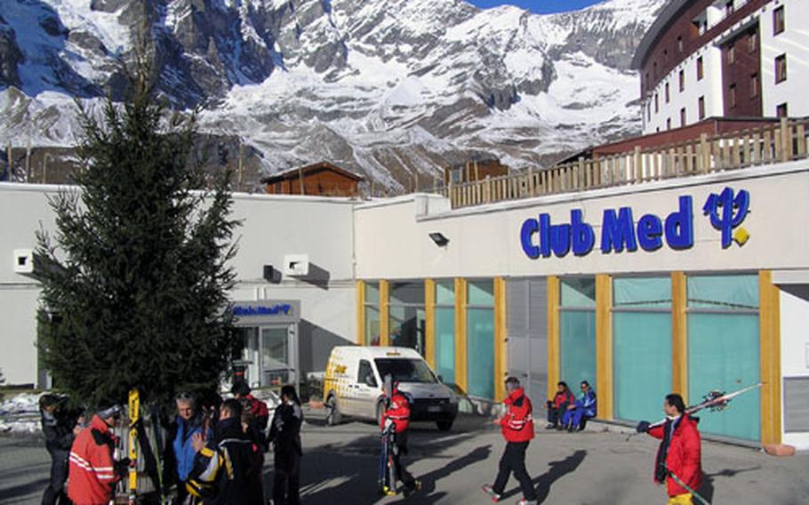 Skiers gather in front of Club Med Cervinia to board Club vans to the nearby slopes.