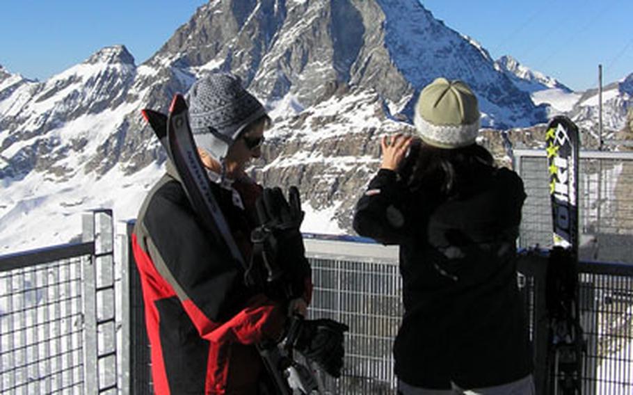 Skiers gather in front of Club Med Cervinia to board Club vans to the nearby slopes.