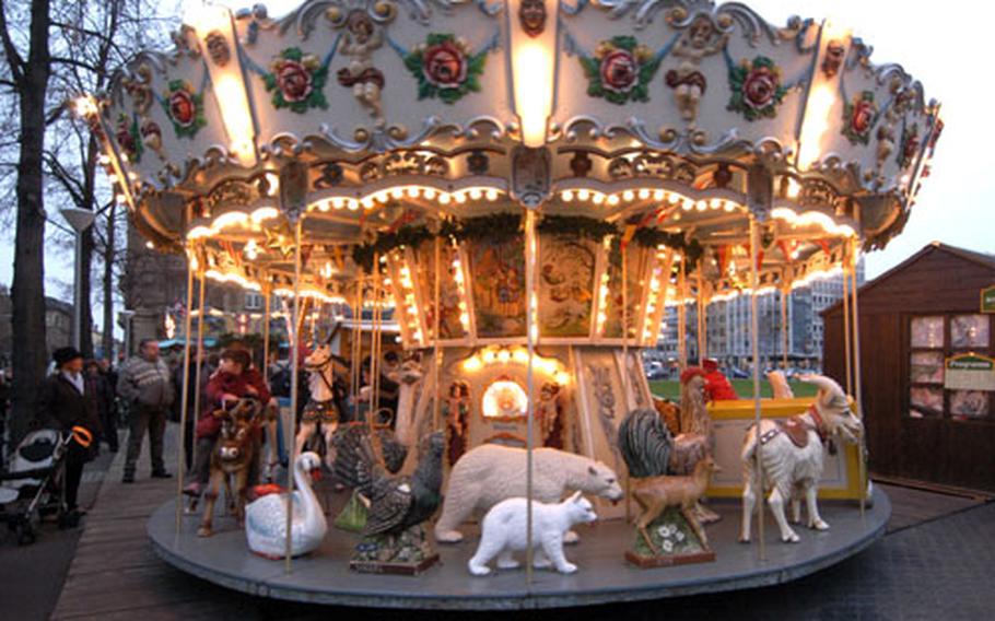 There are rides for the kids at the Christmas market in Mannheim, as there are at most Christmas markets in Germany.