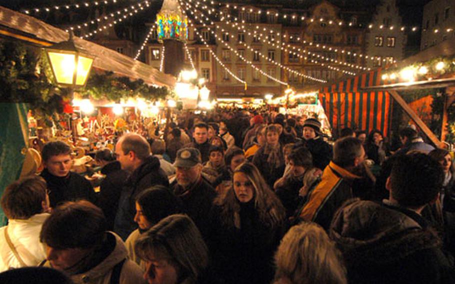 On the Sunday before Christmas, the Mainz, Germany Christmas market is packed with people.