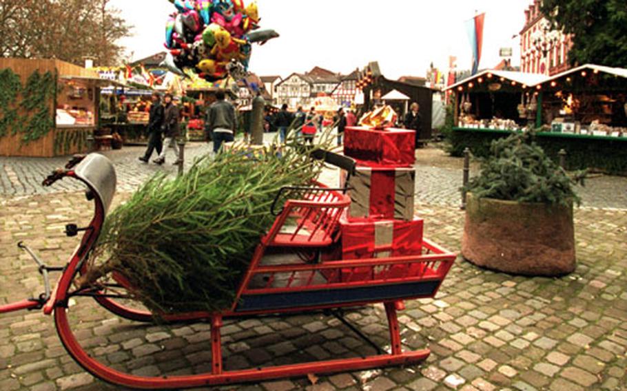 A sled is filled with presents — and a Christmas tree — at Erbach&#39;s Christmas market.