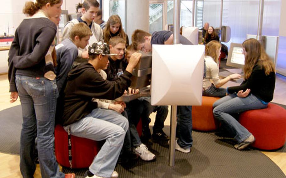 A computer game engages a group of kids at the Museum für Kommunikation (Communication Museum) in Frankfurt.