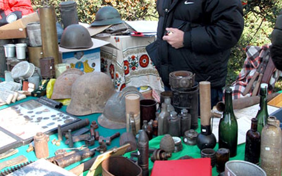 Several vendors sell military items at the Piazzola market. Bob Curci, above, specializes in Austro-Hungarian items from the World War I era.