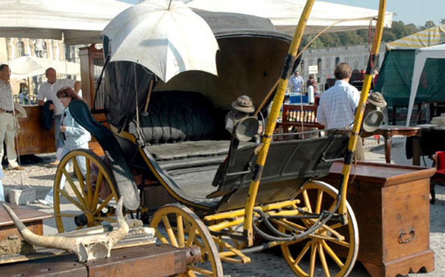 The market at Piazzola sul Brenta, Italy, offers a range of goods beyond the everyday market. On this day, steer horns sit on top of furniture beside an antique buggy.