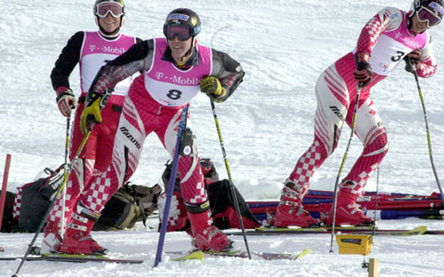 Downhill skiers from the Croatian national team stretch before an October practice in Hintertux, Austria. Many international downhill ski teams practice at Hintertux and other glaciers before the season opens.