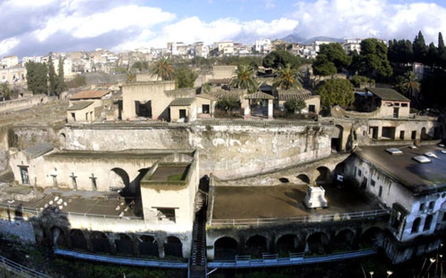 Herculaneum was a beachfront community during Roman times, but is now about a mile inland. Mount Vesuvius, usually visible in the background, is barely visible in the clouds in upper right.