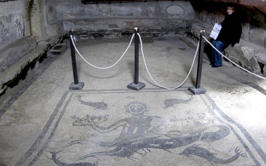 Detailed mosaics on the floor and other well-preserved fixtures in the room give visitors a unique look at a Roman bath in Herculaneum.