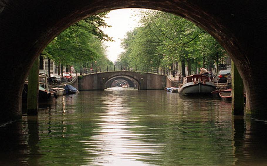 Amsterdam is a city of canals, boats and bridges.