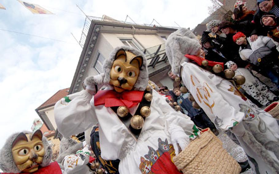 Members of the Katzenzunft (cats guild) from Hardt, Germany, march in the Fasnet parade in Schramberg.