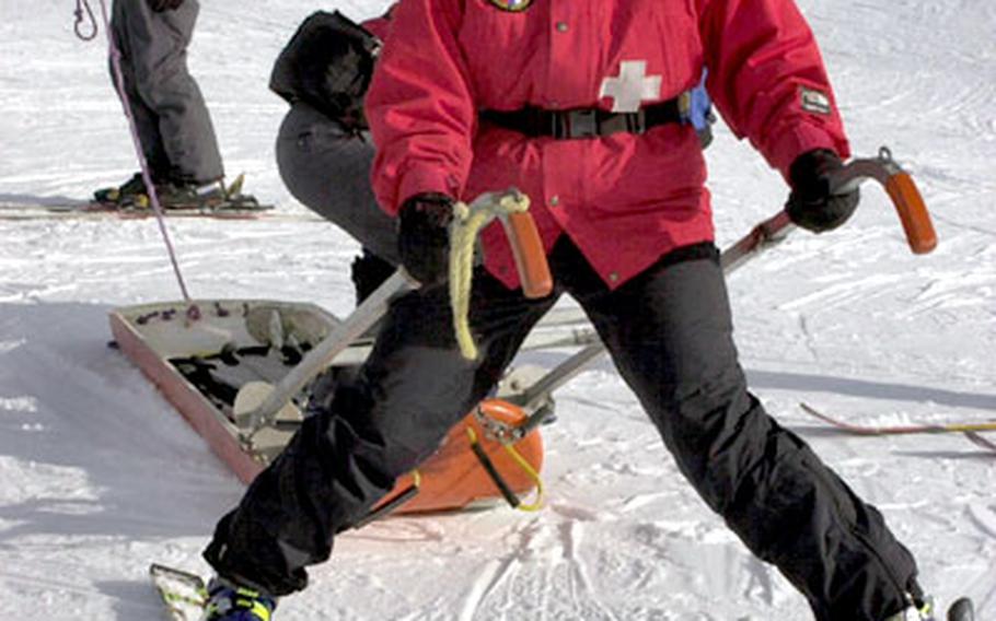 In Hintertux, Austria, patrollers practice in October with a sled used to transport patients. Phyllis Jones grasps the handles and Barry Tiemann holds the tail rope.