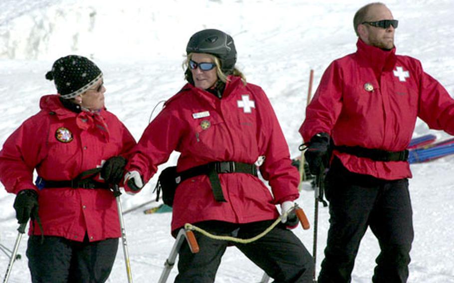 Ski patrol members Phyllis Jones, left, Holly Ginas and Robert Field take a break during training.