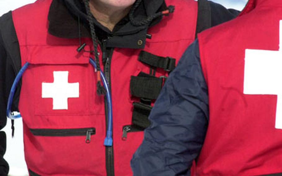 Ed Lynch, a ski patroller from Hohenfels, Germany, talks with a colleague in Hintertux.