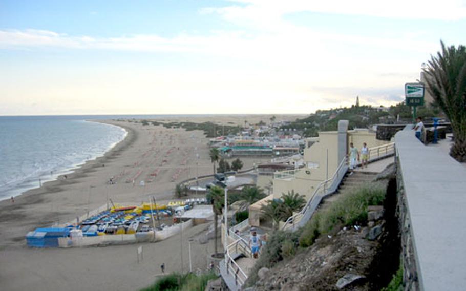 When you’re not partying, shopping or on an amusement ride in Maspalomas, Canary Islands, you can rest on the beach. This is a view of the Playa del Ingles, looking toward the southern tip of the island.