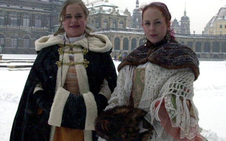 English-speaking tour guides in costume are plentiful in downtown Dresden. The guides are heavily bundled after a recent snowstorm covered much of Germany in a rare blanket of white.