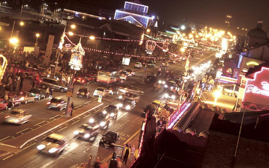 When the weather warms up and nighttime falls, the streets of Great Yarmouth, England, come alive with visitors looking for fun.