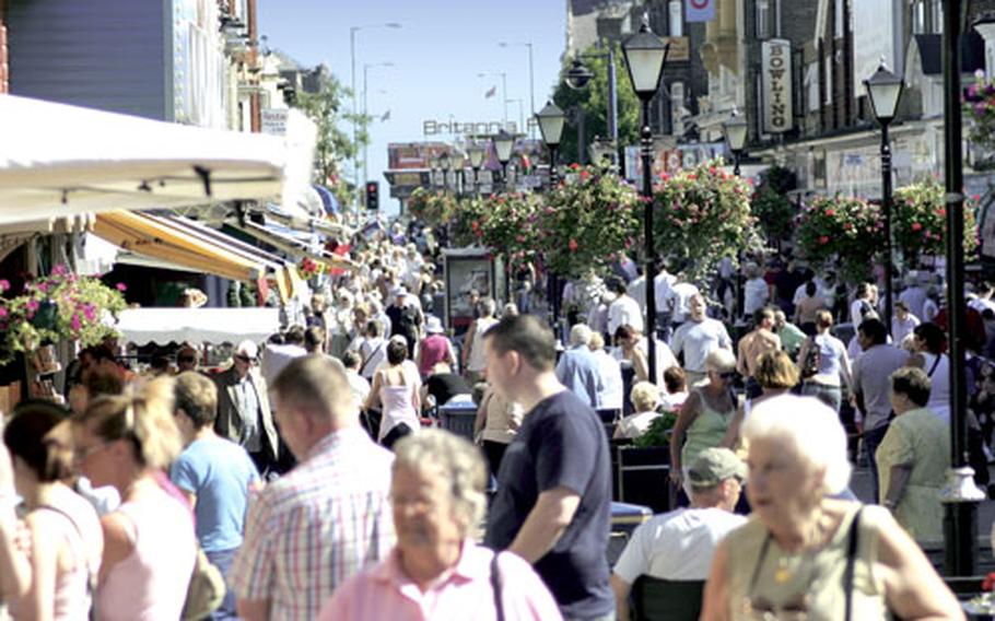 Pedestrians amble through Great Yarmouth’s main shopping districts and entertainment areas.