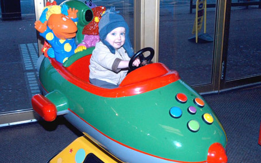 A youngster from RAF Mildenhall enjoys a low-key ride on a rocketship at a Great Yarmouth arcade during the slower winter season. In the spring and summer, expect large crowds.