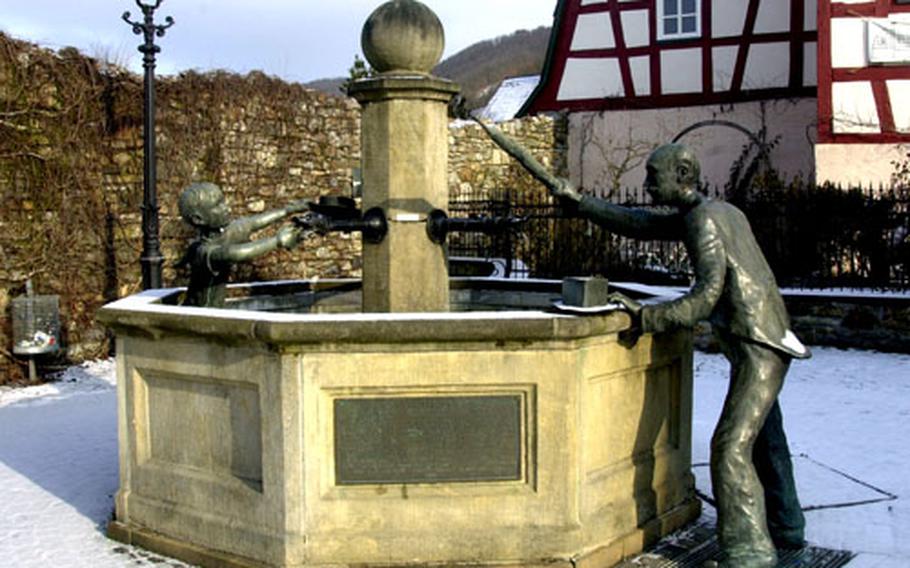 One of several small squares features whimsical bronzes of an oldster chasing a youngster who’s squirted him from the fountain.