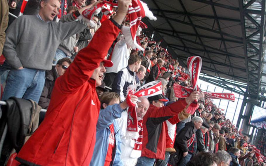 Some fans dress top to toe in team colors and cheer on their soccer clubs in facilities such as the Rhein-Energie Stadium in Cologne.