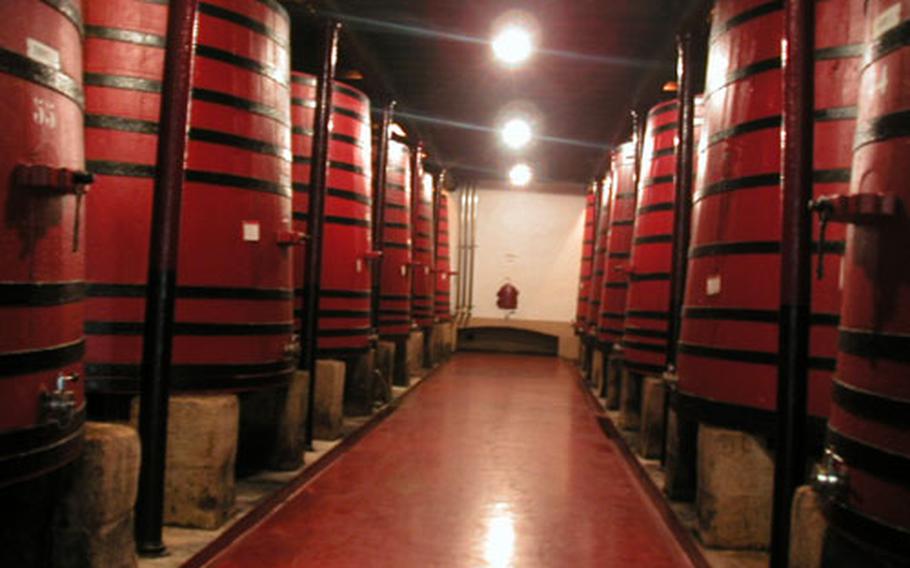 Huge, brightly painted wine casks known as “tinas,” capable of holding 30,000-liters, are stored in the cellar at Bodegas Bilbaínas in Haro, Spain.