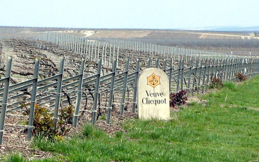 A roadside sign in Bouzy, France, marks the champagne producer that will use the grapes from this vineyard. Only grapes grown in the Champagne region can be used to make the bubbly creation known around the world.