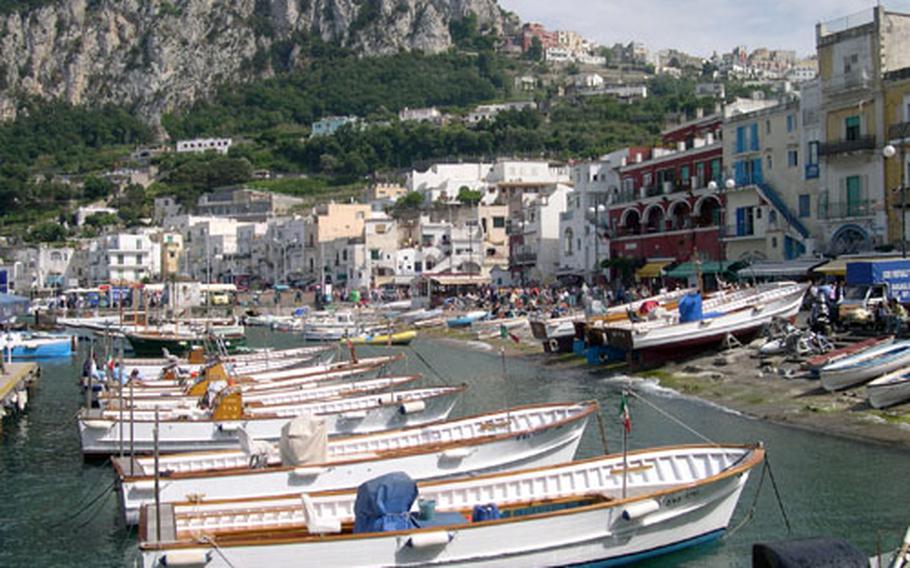 Small boats sit at anchor in Capri’s grand harbor. A hillside railway — funicular — travels between Capri Town and the port, but only when workers aren’t on strike. The boats are available to hire for trips around the island or to the famed Blue Grotto.