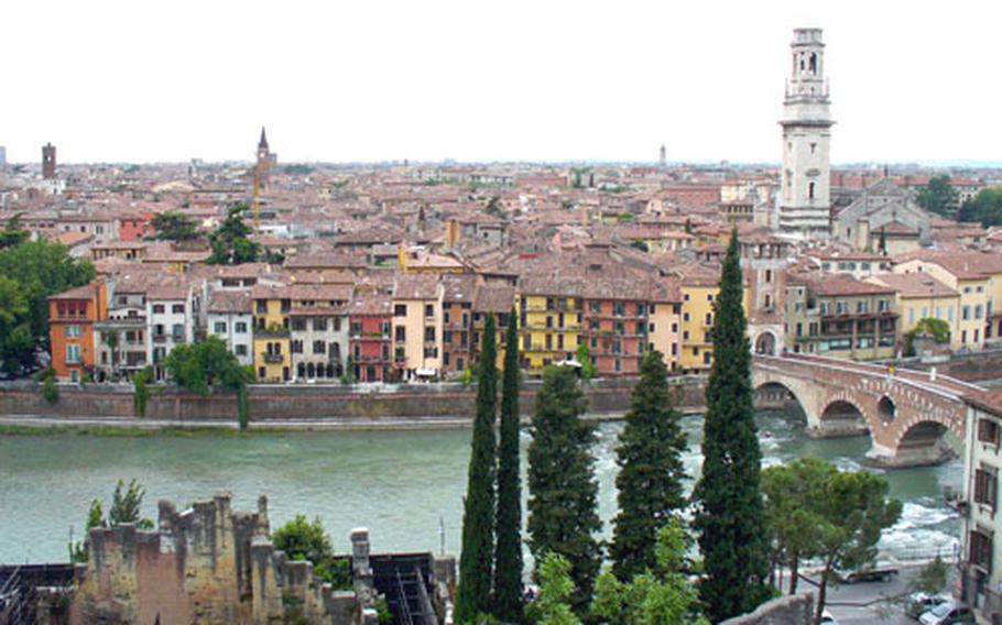 The old Roman bridge, the Ponte Pietra, right, crosses the Adige River and connects the two sides of Verona, Italy.
