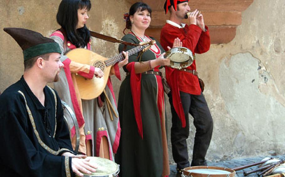 At one of the castle’s many medieval events, minstrels dressed in period costumes entertain in the Ronneburg’s inner courtyard.