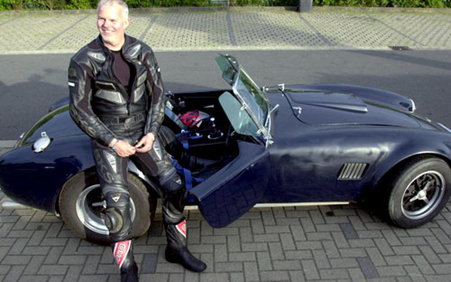 British attorney Vaughn Fullagar brought two vintage race cars, including this A.C. Cobra, and several motorcycles from his home in Swindon, England. He even offered to lend others a vehicle.