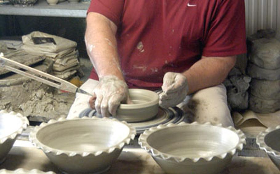 A potter works at his wheel in Soufflenheim, France. Soufflenheim and Betschdorf, both in northern Alsace, are renowned for their pottery.