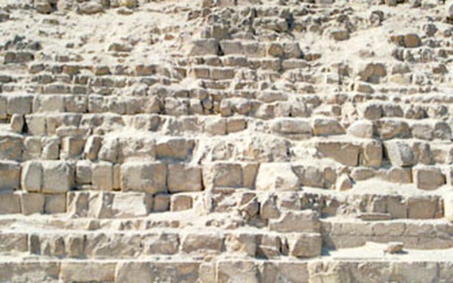 “Sam” the guide sits atop his horse at the base of the back side of the Great Pyramid of Khafre, where he leads tourists to climb on the flanks of the great tomb.