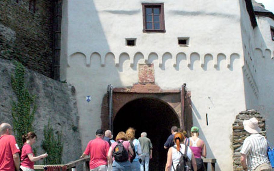 Members of Dr. George Neblett’s tour group prepare to enter Marksburg castle. The two openings above the gate were used to pour hot sand, pitch or oil on invaders.