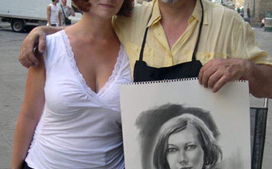 Marco Ramazzotti poses with a satisfied customer after finishing her portrait.