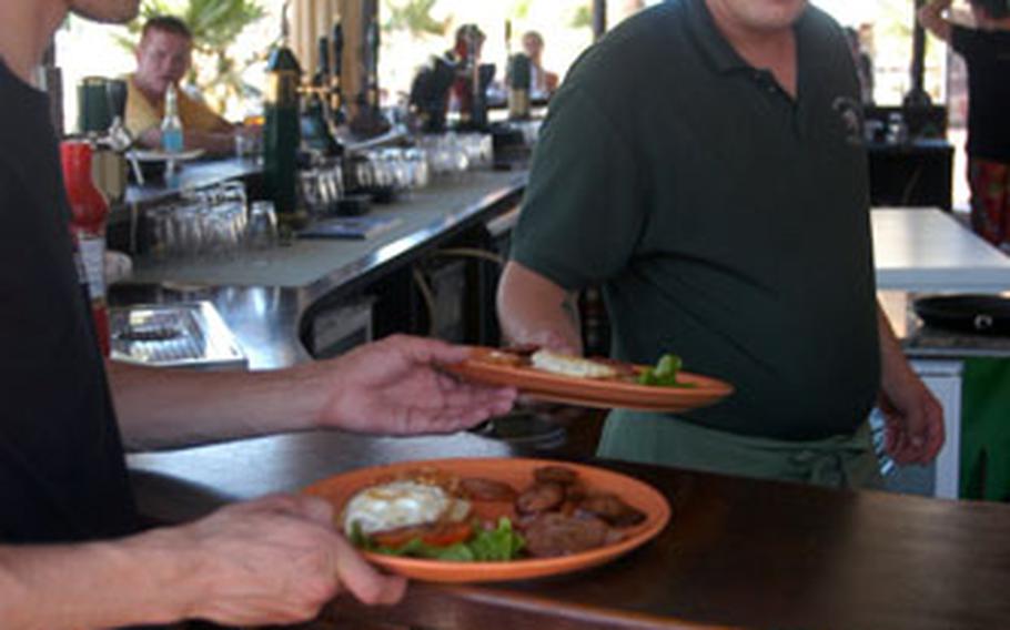 English-style bistros serve hearty breakfasts of eggs, ham, beans, bread and tea at the Golden Sands resort north of Varna, Bulgaria.