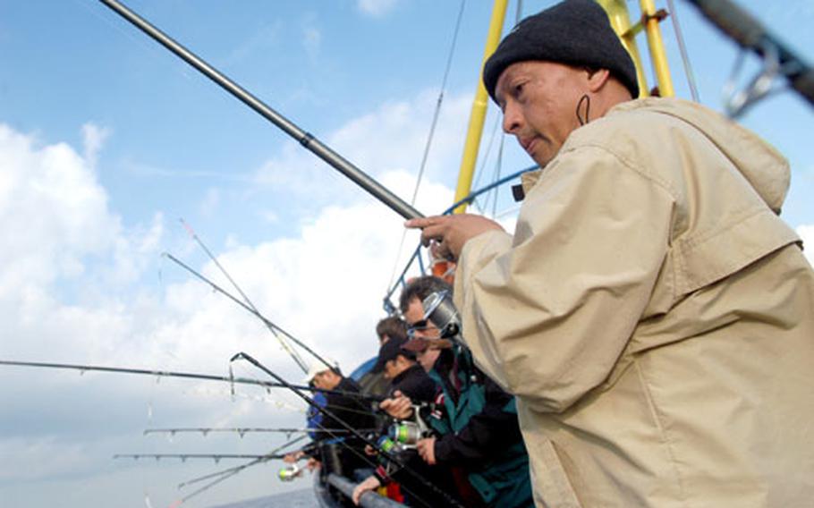 William Gomez watches his line as he fishes off the vessel M.S. Maria in the North Sea. Gomez and 33 other people paid $120 each to go on the trip, organized by Kaiserslautern Outdoor Recreation.