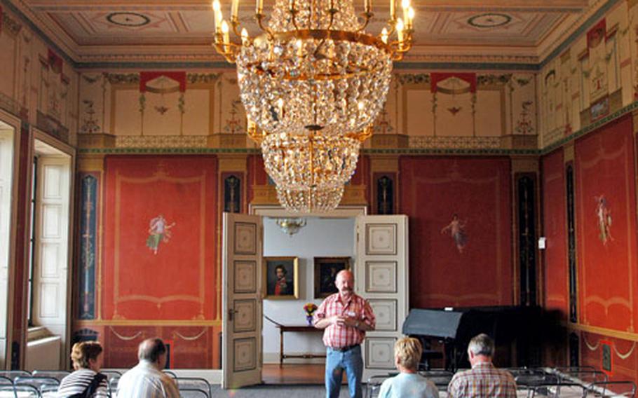 Guide Josef Mootz offers his view of the the Pompeiian Hall, one of the most decorative rooms of the villa.