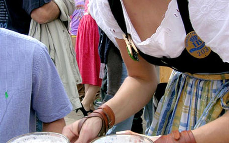 Order up! A waitress wears wrist supports for the long day of serving one-liter mugs of brew at Oktoberfest.