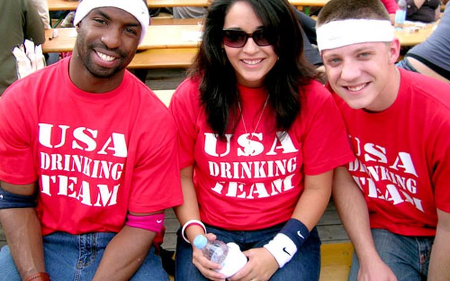 From left, Armstrong Expete, Veronica Norful and Jimmy Snyder wear special T-shirts on the opening day of Oktoberfest 2006. They were with a group of U.S. airmen from Geilenkirchen, Germany.